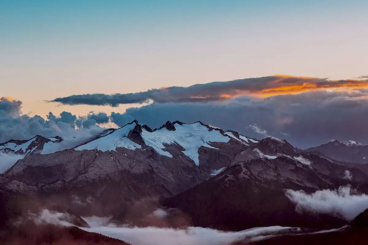 Resilient Minds snow-covered mountains with beautiful sunset clouds